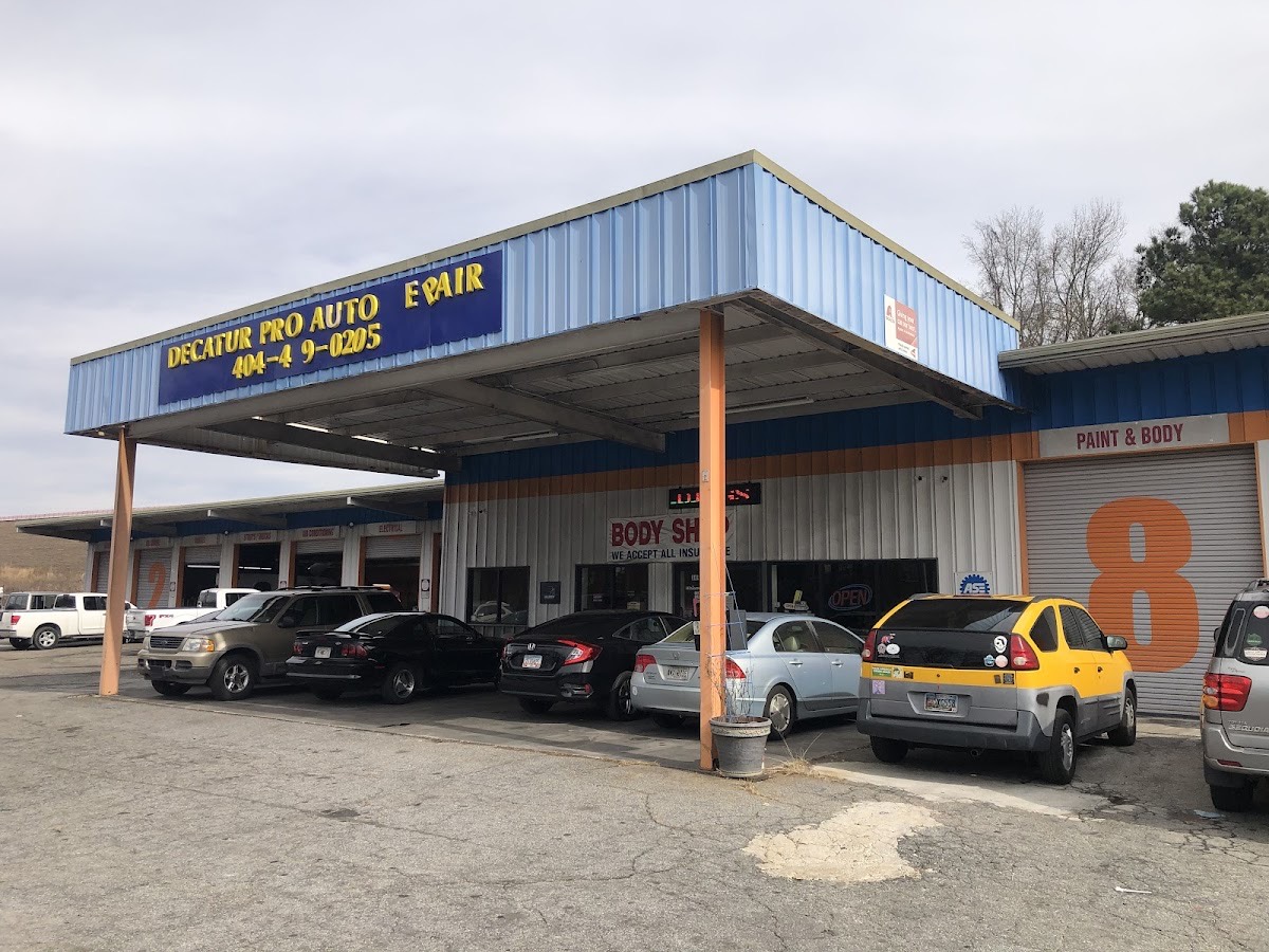 The Decatur Pro Auto Repair service bays with customer vehicles parked under the canopy